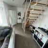 6 Wohnbereich mit Treppe zum Loft